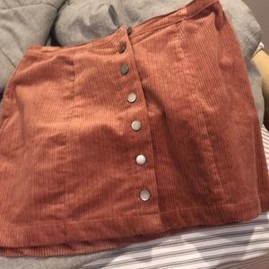 a short skirt almost like  a light maroon color